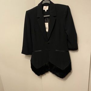 Long fringed blazer (hits mid to low thigh), 3/4 length sleeves with buttons.